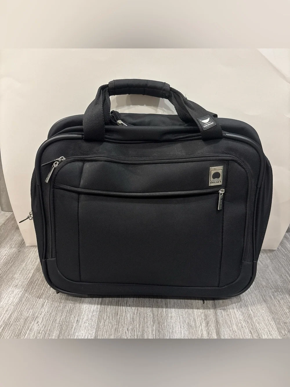 Delsey Paris black travel carryon with wheels luggage suitcase travel